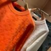 LVE Embossed Monogram Jumper – Burnt Orange