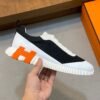 HRMS Mesh Low-Top Trainers – Black & White with Orange Detail