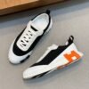 HRMS Mesh Low-Top Trainers – Black & White with Orange Detail