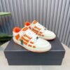 AMR Skel Leather Trainers – White with Orange Accents