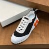 HRMS Mesh Low-Top Trainers – Black & White with Orange Detail
