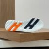 HRMS Mesh Low-Top Trainers – Black & White with Orange Detail