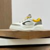 FND Low-Top Trainers with Subtle Yellow Accents - Grey/White