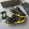 BLNCG Chunky Low-Top Trainers in Black with Yellow Contrast Accents