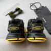 BLNCG Chunky Low-Top Trainers in Black with Yellow Contrast Accents